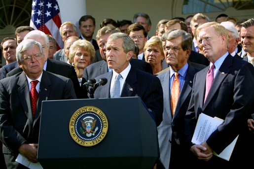 Members of the House of Representatives Senate surround President George W. Bush as he announces the Joint resolution to Authorize the Use of United States Armed Forces Against Iraq in October 2002.  